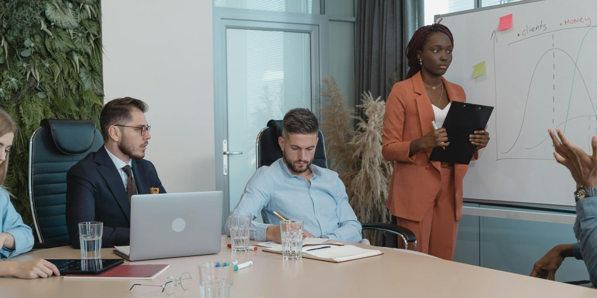 A diverse team collaborating around a whiteboard, strategizing solutions for complex AI integration challenges.