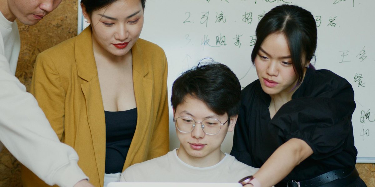 A team collaboratively discussing a complex challenge, symbolizing the need for trust in advanced AI systems.