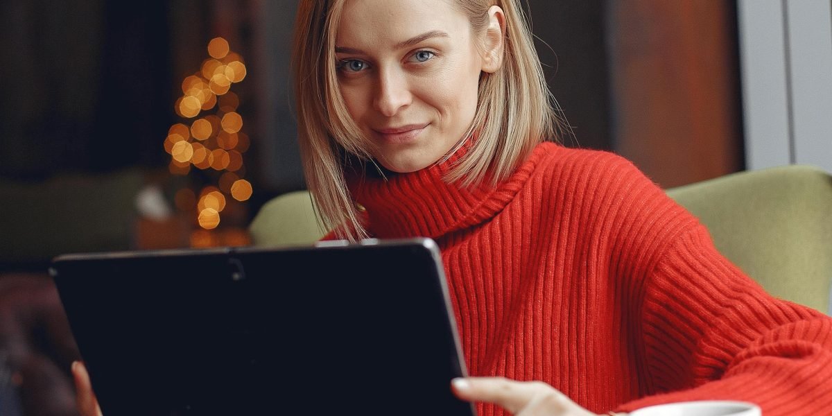 A person using a mobile device in a casual setting, highlighting the convenience of mobile-friendly AI video tools.
