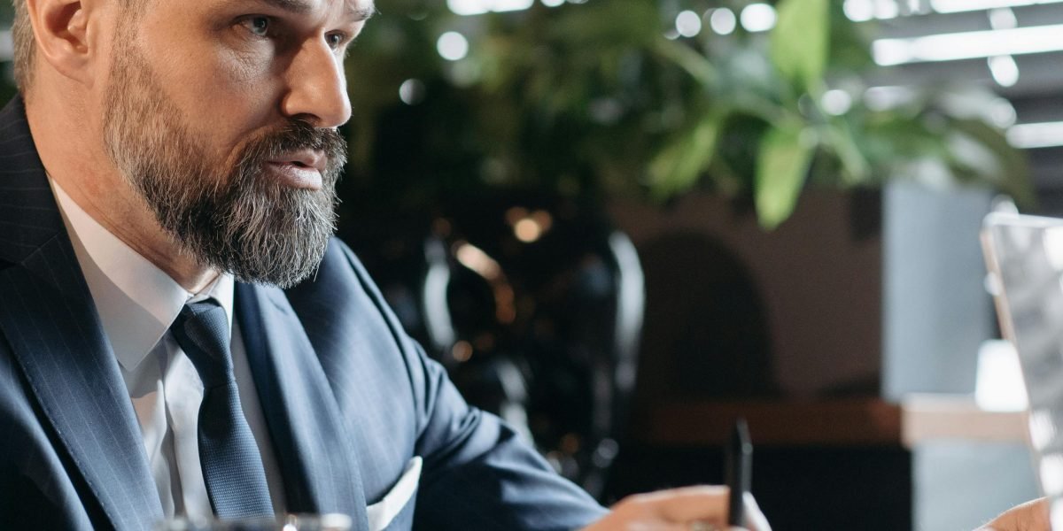 A professional contemplating a difficult choice, reflecting the ethical dilemmas and significant risks posed by AI errors.