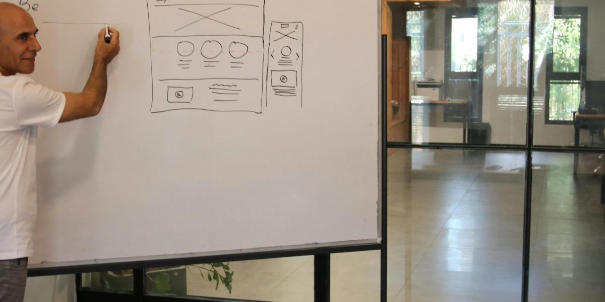 A designer works on a visual project, representing the real-world application of AI image generators for cartoons, diagrams, and design mockups.