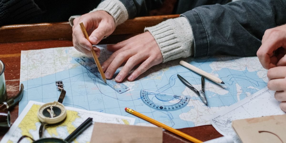 Team members reviewing a map, identifying a discrepancy or discussing a complex route based on potential AI errors.