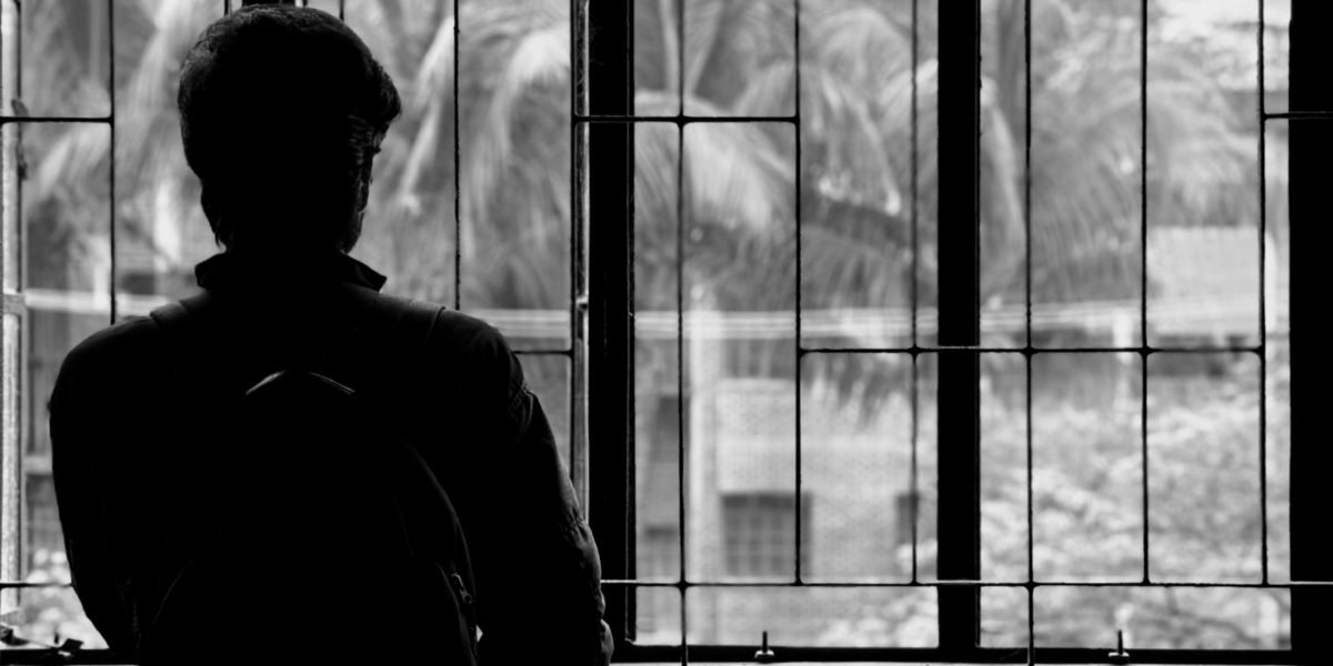 A person appears thoughtful and perhaps overwhelmed by the constant influx of digital information, symbolizing the blurring of reality.