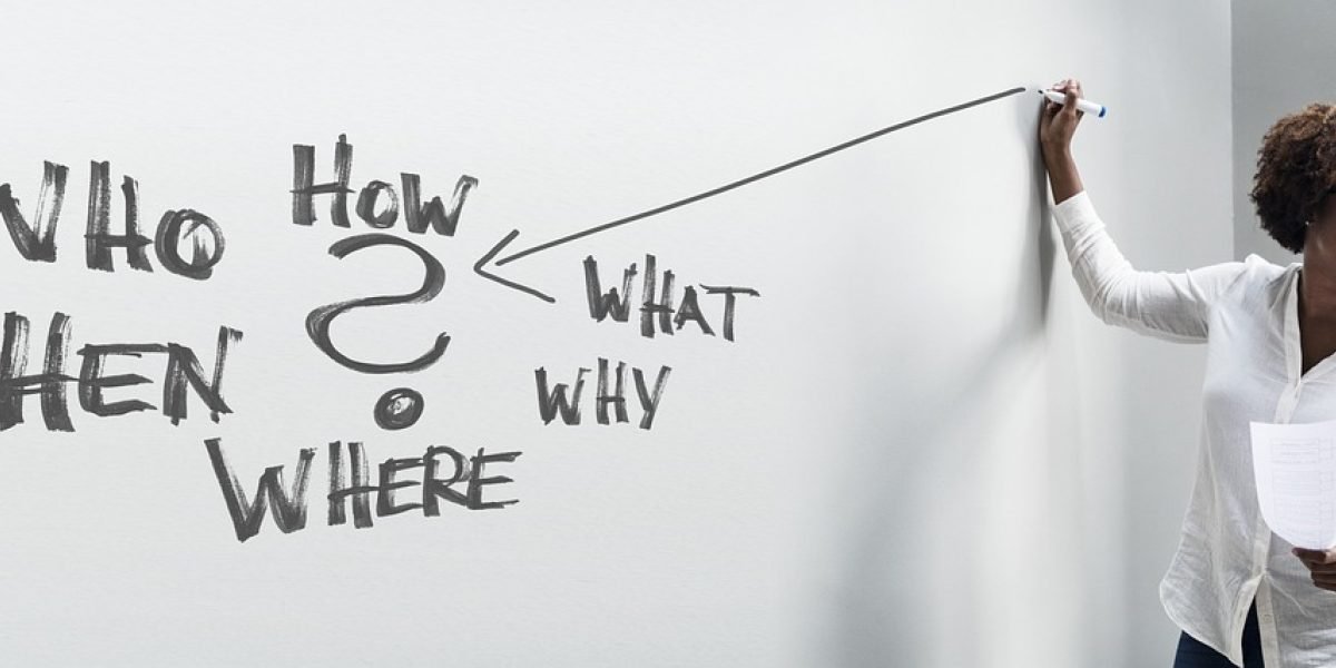 A diverse team collaboratively brainstorming solutions on a whiteboard, aiming for trustworthy AI applications.