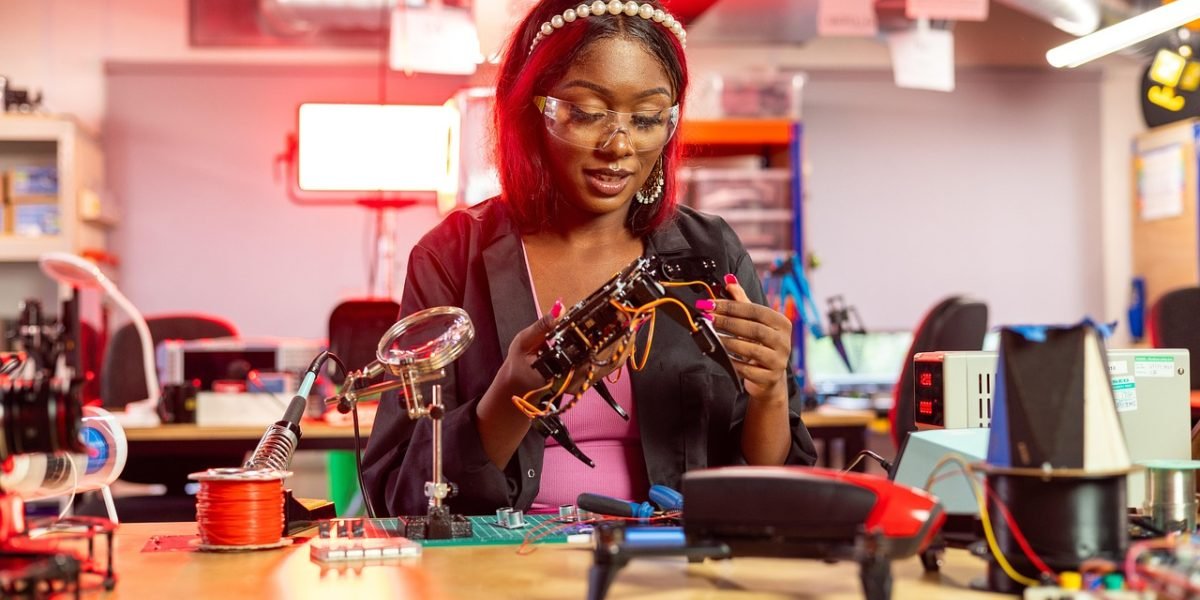 A team of engineers intently reviewing technical blueprints, representing the meticulous design and architecture required for robust AI systems in autonomous vehicles.
