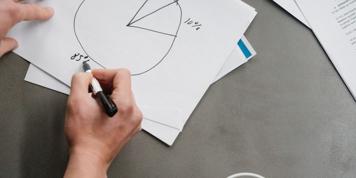 A person meticulously reviewing complex data or reports, symbolizing the critical human-in-the-loop oversight for AI systems.