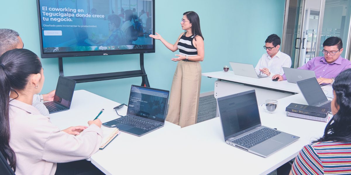 A team actively collaborates in a meeting room, emphasizing shared responsibility and verification in enterprise AI usage.