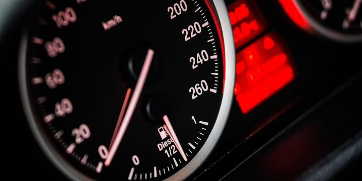 A driver looks perplexed at their car's dashboard, reflecting potential confusion from AI hallucinations.