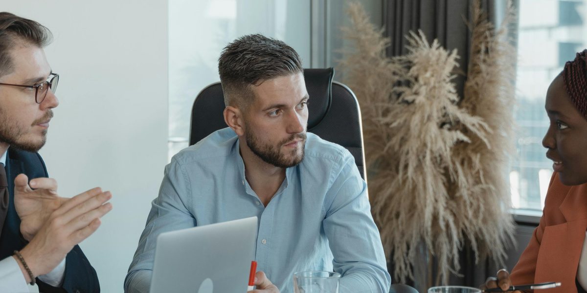 A team discusses potential risks and challenges associated with AI applications in a business setting.