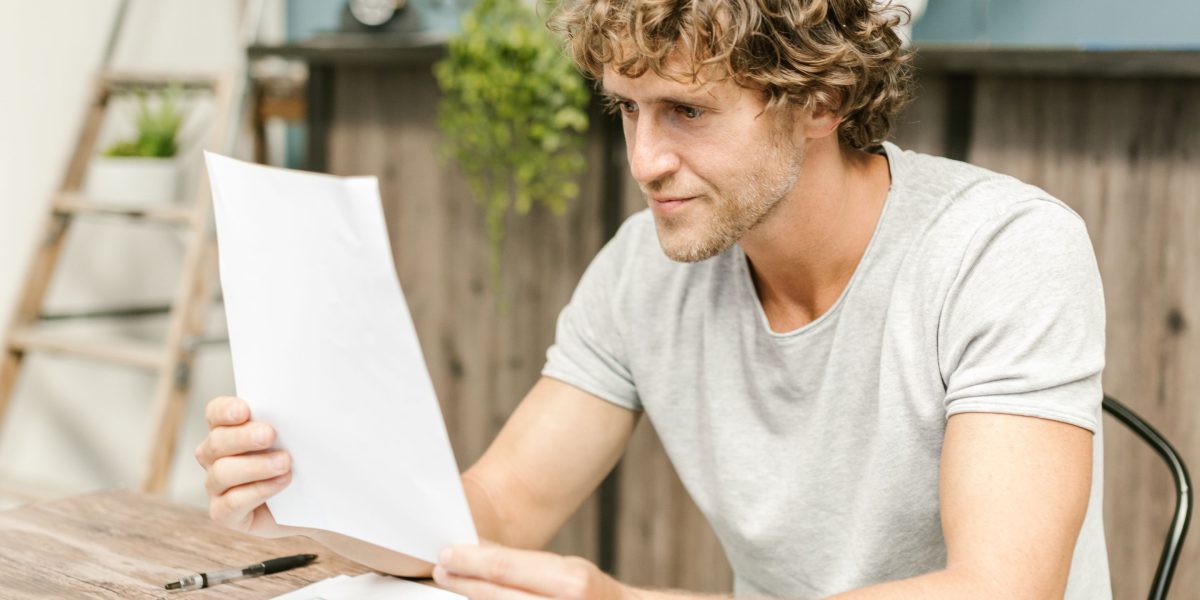 A person intently reviewing generated content or data, highlighting the need for human oversight with AI tools.