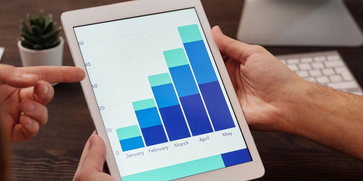 A group of professionals intently reviewing an analytics dashboard, demonstrating integrated mitigation efforts in a business intelligence pipeline.