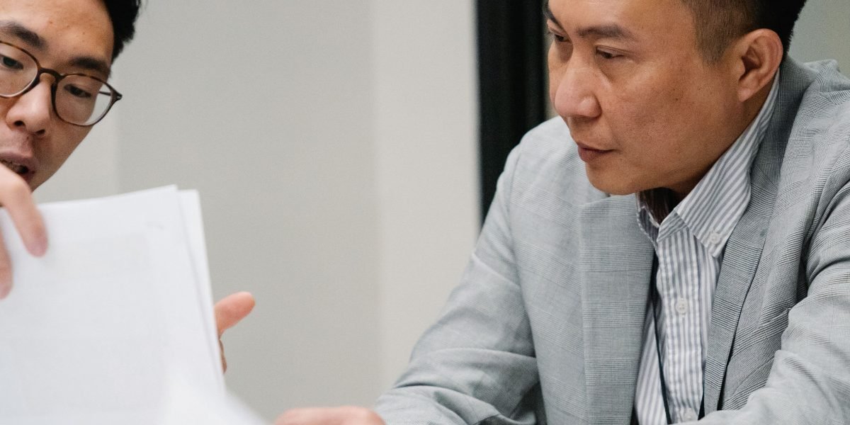 A team collaborates to meticulously review complex documents, highlighting the need for accuracy in critical industries.