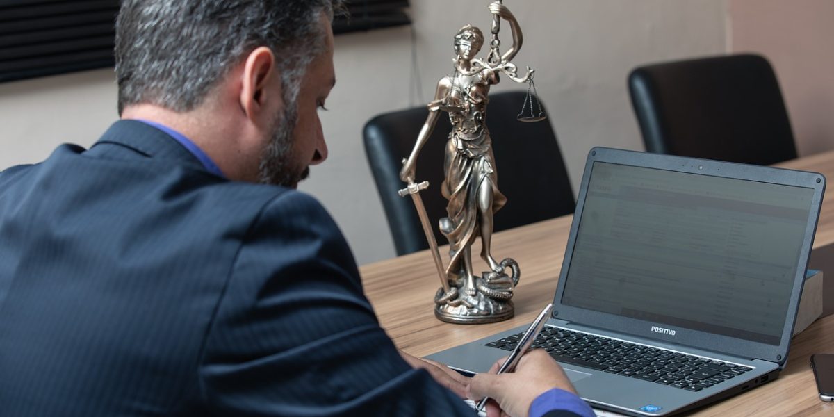 A team of professionals diligently reviews documents, highlighting the need for human oversight in critical applications.