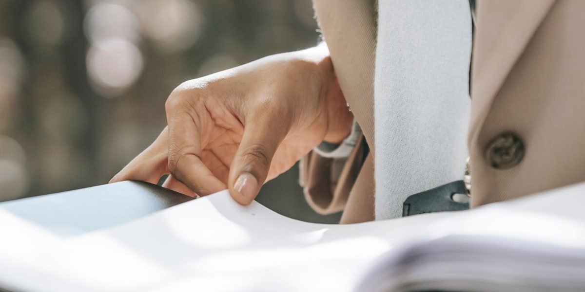 A government official reviewing critical documents, symbolizing regulatory oversight and safety investigations in the automotive industry.