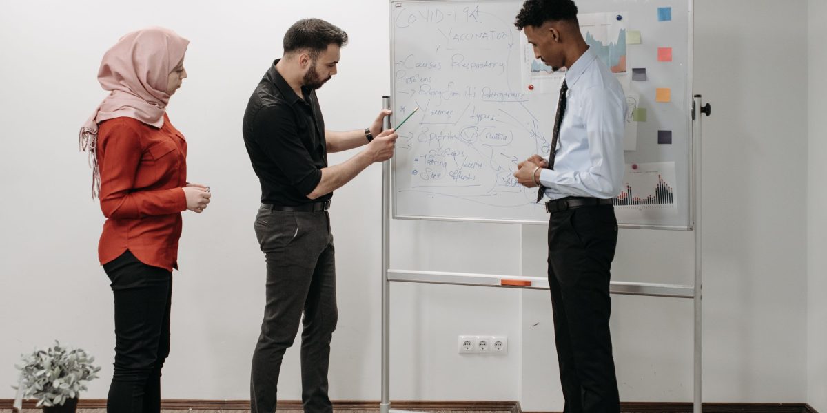A diverse team collaborating actively on a strategic plan, emphasizing structured workflows and shared understanding.