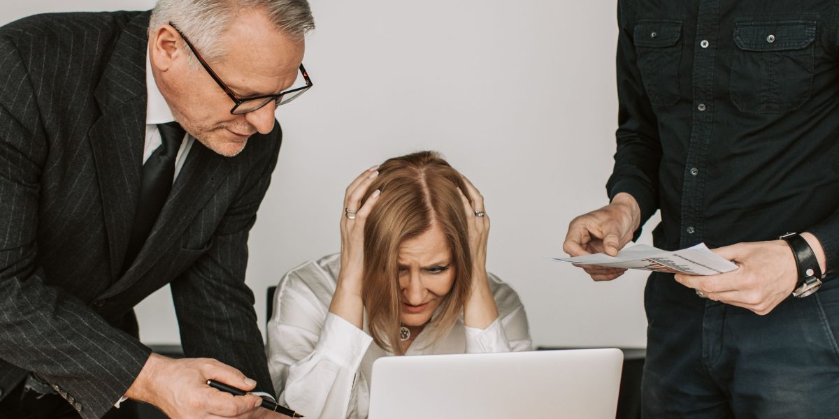 A business person appearing to deal with a complex problem, reflecting the consequences of AI-driven errors.