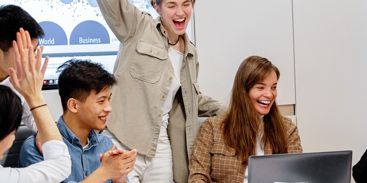A team celebrates a successful project milestone, reflecting the positive outcomes of a carefully implemented AI roadmap.