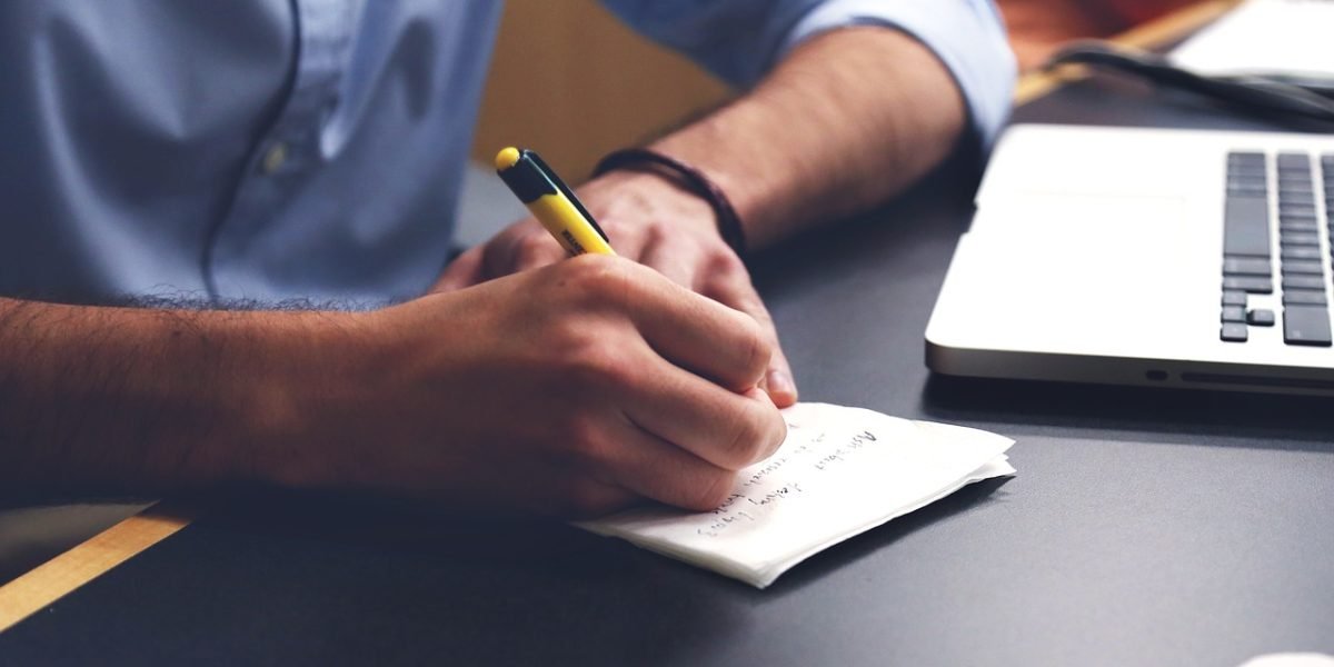 A person thoughtfully reviewing information, symbolizing the need for smart choices when navigating complex topics like EV ownership, policy, and technology risks.