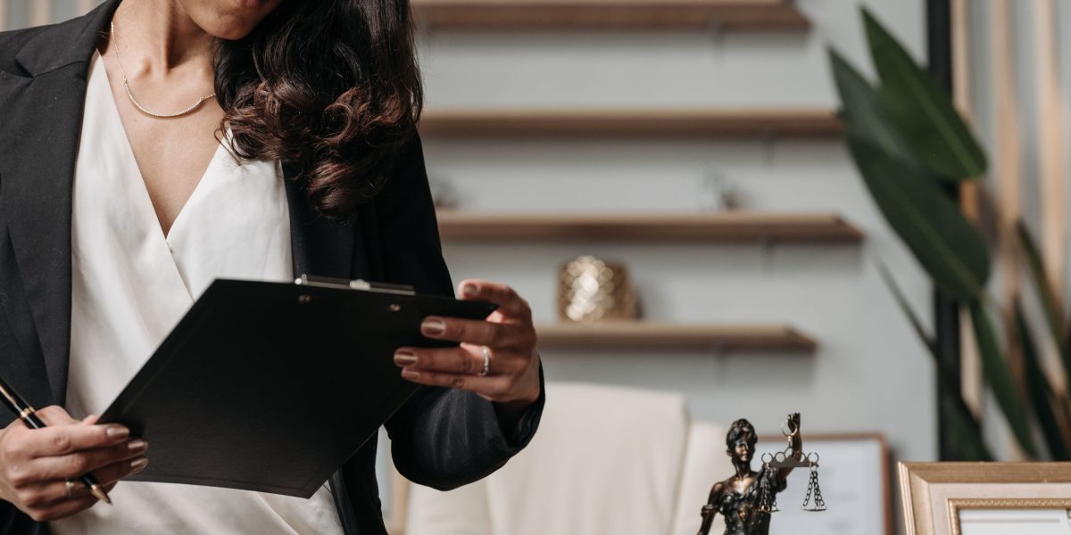 Professionals review legal documents, underscoring the necessity for accuracy and verification in AI-generated information to avoid legal pitfalls.