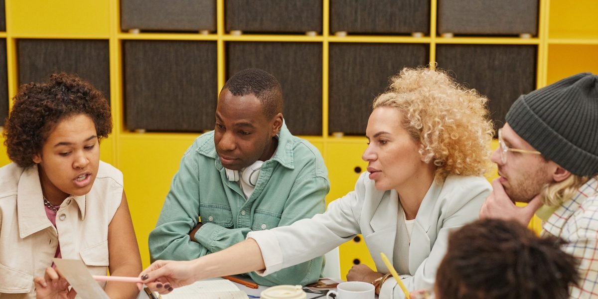 A team collaborating to establish robust governance frameworks, policies, and ethical guidelines for AI usage in an organization.